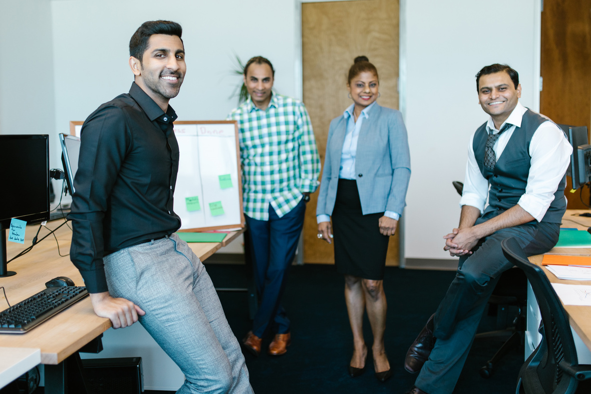 Group of People Standing Inside an Office